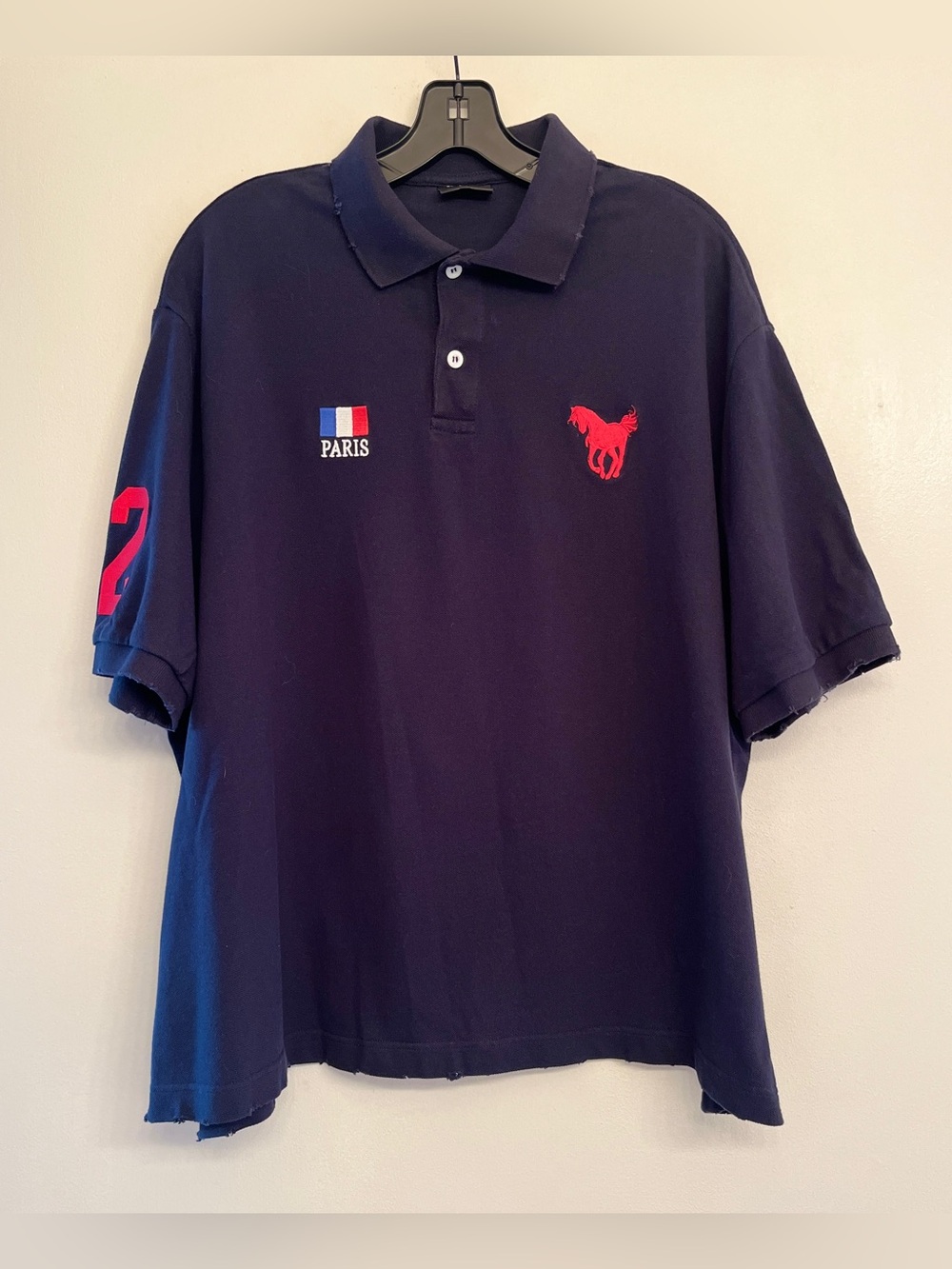 Balenciaga Paris Oversized polo shirt features a red embroidered horseS. Unisex